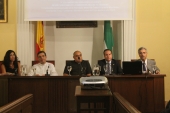 en la mesa presidencial de izquierda a derecha; Dª. Silvia Heredia (Primera Tte. Alcalde Delegada de Presidencia del Excmo. Ayuntamiento de Écija, Rvdo. Sr. D. Ángel F. Del Marco Ostos, Rvdo Sr. D. Francisco Reina Chía, D.Francisco Javier Rojas (Hermano Mayor), D. José Enrique Caldero Bermudo